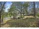 Charming backyard featuring a lakeside gazebo, perfect for relaxing and enjoying the serene water views at 100 Lakeview Dr, Summerville, SC 29485