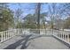Balcony with white railing overlooking trees and water at 100 Lakeview Dr, Summerville, SC 29485
