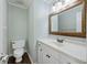Powder room featuring classic vanity, framed mirror, and neutral decor for a fresh, elegant look at 100 Lakeview Dr, Summerville, SC 29485