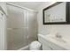 Bathroom featuring a shower with glass door, neutral vanity, and framed mirror at 100 Lakeview Dr, Summerville, SC 29485