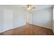 Bright bedroom with hardwood floors, featuring neutral walls, ceiling fan and natural light at 100 Lakeview Dr, Summerville, SC 29485