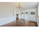 Bright dining room featuring hardwood floors, chandelier, and open access to kitchen and sunroom at 100 Lakeview Dr, Summerville, SC 29485