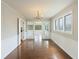 Elegant dining room featuring hardwood floors, wainscoting, and a chandelier, perfect for entertaining at 100 Lakeview Dr, Summerville, SC 29485
