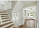 Inviting entryway with hardwood floors, staircase, and views into adjacent rooms at 100 Lakeview Dr, Summerville, SC 29485