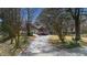 Inviting two-story brick home with a well-manicured lawn and a long driveway at 100 Lakeview Dr, Summerville, SC 29485