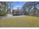 Home featuring a brick accent, blue shutters, a welcoming front porch, and mature landscaping at 100 Lakeview Dr, Summerville, SC 29485