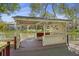 Lakeside gazebo with a charming bar and ample seating for outdoor entertaining at 100 Lakeview Dr, Summerville, SC 29485