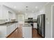 Well-lit kitchen with granite countertops, a central island, and modern stainless steel appliances at 100 Lakeview Dr, Summerville, SC 29485