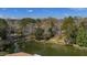 An aerial view of a waterfront home, lake, and neighboring properties at 100 Lakeview Dr, Summerville, SC 29485