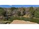A serene lake view featuring a waterfront home with a private dock at 100 Lakeview Dr, Summerville, SC 29485