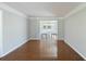 Spacious living room showcasing hardwood floors and elegant trim, leading into the dining room at 100 Lakeview Dr, Summerville, SC 29485