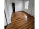 Bedroom features refinished wood floors and a window providing natural light at 101 Queen St, Charleston, SC 29401