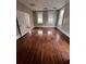 Bedroom with windows, natural light and original hardwood floors at 101 Queen St, Charleston, SC 29401