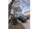 Two-story house with a light blue facade, accented by white trim and natural landscaping at 101 Queen St, Charleston, SC 29401