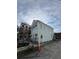 Exterior view of light blue two-story house with an outside staircase, and exterior views at 101 Queen St, Charleston, SC 29401