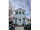 Charming two-story house with a light blue facade, white trim, and matching blue doors and awnings at 101 Queen St, Charleston, SC 29401