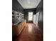 This kitchen features wooden cabinets, a stainless steel sink, and open shelving for ample storage at 101 Queen St, Charleston, SC 29401