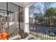 Cozy balcony with comfortable seating and views of trees and community at 1025 Riverland Woods Pl # 116, Charleston, SC 29412