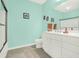 Well-lit bathroom with double vanity, sleek shower, and modern fixtures at 1025 Riverland Woods Pl # 116, Charleston, SC 29412