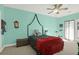 Bright bedroom with turquoise walls, a king-size bed, and lots of natural light at 1025 Riverland Woods Pl # 116, Charleston, SC 29412