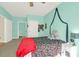 Bright bedroom featuring charming decor, neutral carpet, and an open door to another room at 1025 Riverland Woods Pl # 116, Charleston, SC 29412