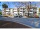 Exterior of condo building showing parking area, screened porches and common walkway at 1025 Riverland Woods Pl # 116, Charleston, SC 29412