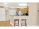Kitchen area with stainless steel appliances, breakfast bar, and lots of cabinet storage at 1025 Riverland Woods Pl # 116, Charleston, SC 29412