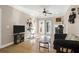 Open living room featuring a ceiling fan, hardwood floors, and a fireplace at 1025 Riverland Woods Pl # 116, Charleston, SC 29412