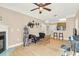 Living room with hardwood floors, a fireplace, and seamlessly open to the kitchen area at 1025 Riverland Woods Pl # 116, Charleston, SC 29412