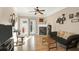 Comfortable living room with hardwood floors, lots of natural light, and a fireplace at 1025 Riverland Woods Pl # 116, Charleston, SC 29412