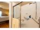 Accessible shower with grab bars and a glass door, located off the main bedroom at 1025 Riverland Woods Pl # 907, Charleston, SC 29412