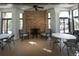 Inviting community room with stone fireplace, comfortable seating, and views of outdoors at 1025 Riverland Woods Pl # 907, Charleston, SC 29412