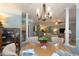 Light and airy dining room featuring a chandelier and an open floor plan into the kitchen and living area at 1025 Riverland Woods Pl # 907, Charleston, SC 29412