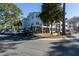 Apartment building exterior with well-maintained landscaping, ample parking, and convenient access to amenities at 1025 Riverland Woods Pl # 907, Charleston, SC 29412