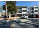 Exterior shot of an apartment building featuring private balconies, ample parking, and great curb appeal at 1025 Riverland Woods Pl # 907, Charleston, SC 29412