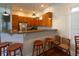 Kitchen area featuring wooden cabinets, stainless steel appliances, and granite countertops at 1025 Riverland Woods Pl # 907, Charleston, SC 29412