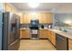 Bright kitchen with stainless steel appliances and light wood cabinetry at 1025 Riverland Woods Pl # 907, Charleston, SC 29412