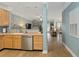 Kitchen with stainless steel appliances, light wood cabinets, and an open floor plan at 1025 Riverland Woods Pl # 907, Charleston, SC 29412