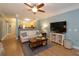 Inviting living room featuring a fireplace, flat-screen TV, and hardwood floors at 1025 Riverland Woods Pl # 907, Charleston, SC 29412