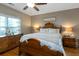 Comfortable main bedroom featuring a ceiling fan and hardwood floors at 1025 Riverland Woods Pl # 907, Charleston, SC 29412