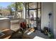Cozy screened porch with seating area and view of the community at 1025 Riverland Woods Pl # 907, Charleston, SC 29412