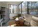 Inviting screened-in porch with seating, offering a relaxed outdoor space at 1025 Riverland Woods Pl # 907, Charleston, SC 29412