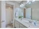 Bathroom features dual sinks, white cabinets, a large mirror, and a shower curtain at 103 Sago Palm Ct, Summerville, SC 29483