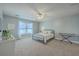 Bedroom features a twin bed, ceiling fan, white walls, and a window with curtains at 103 Sago Palm Ct, Summerville, SC 29483