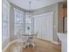 Charming dining area with ample windows and a modern light fixture at 103 Sago Palm Ct, Summerville, SC 29483