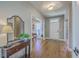 Elegant foyer with hardwood floors, a stylish mirror, and ample natural light at 103 Sago Palm Ct, Summerville, SC 29483