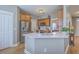 Bright kitchen with stainless steel appliances, white countertop, and wooden cabinets at 103 Sago Palm Ct, Summerville, SC 29483