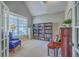 Bright office with a large window, bookcase, piano, and comfortable seating at 103 Sago Palm Ct, Summerville, SC 29483