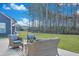 Beautiful backyard with patio furniture, mature trees, and a lush green lawn at 107 Willett Ln, Summerville, SC 29486