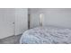 Bright bedroom showcasing neutral walls, carpet, and doors with a view into the bathroom at 107 Willett Ln, Summerville, SC 29486